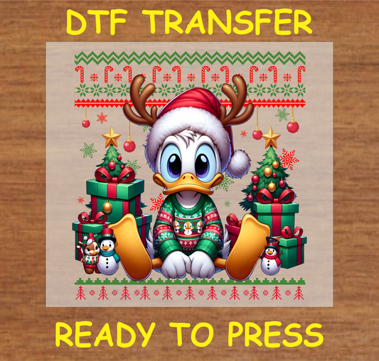 Christmas duck in festive sweater with reindeer antlers, surrounded by Christmas tree, gifts, and holiday decorations DTF transfer.