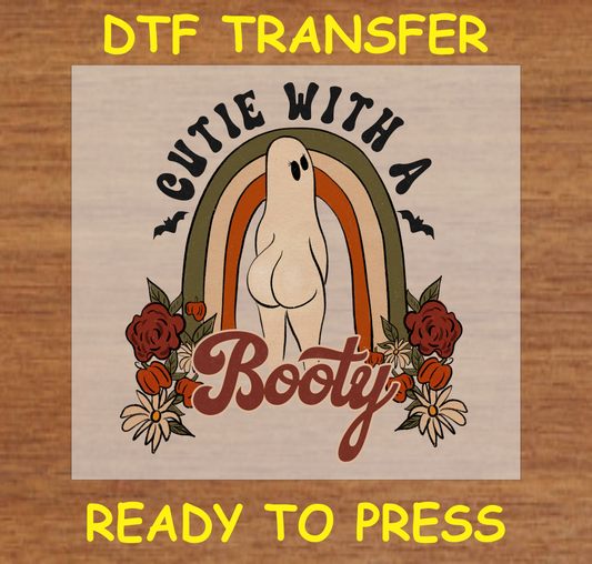 Cute ghost with a retro rainbow background and text "Cutie with a Booty" DTF transfer.