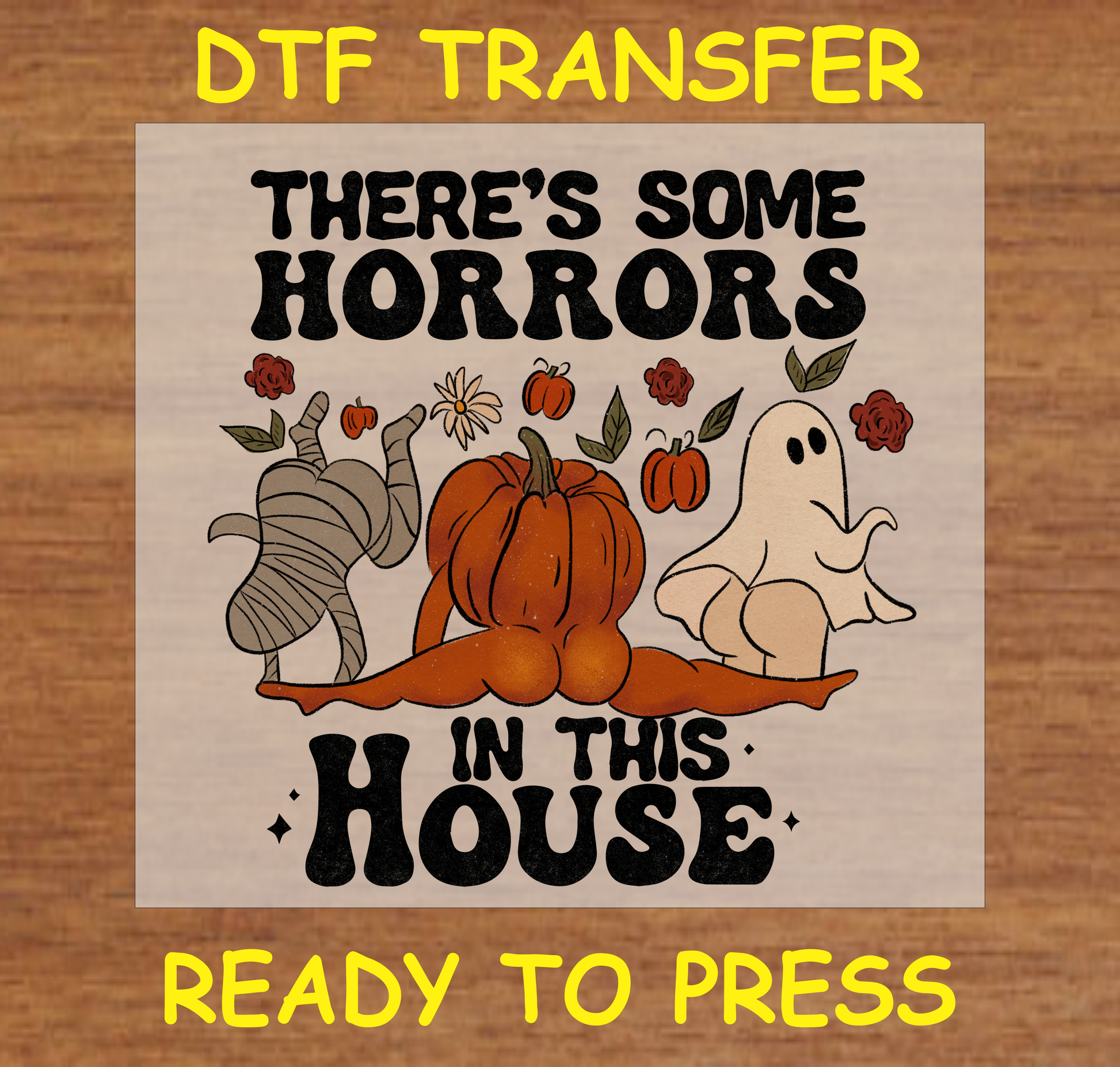 Halloween-themed DTF transfer featuring a pumpkin, ghost, and mummy with floral accents and the text "There's Some Horrors in This House."