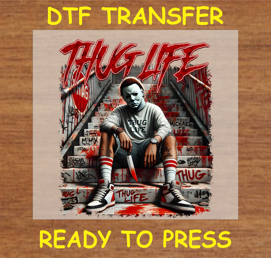 Thug Life DTF Transfer featuring graffiti background and horror character sitting on steps, holding a knife.