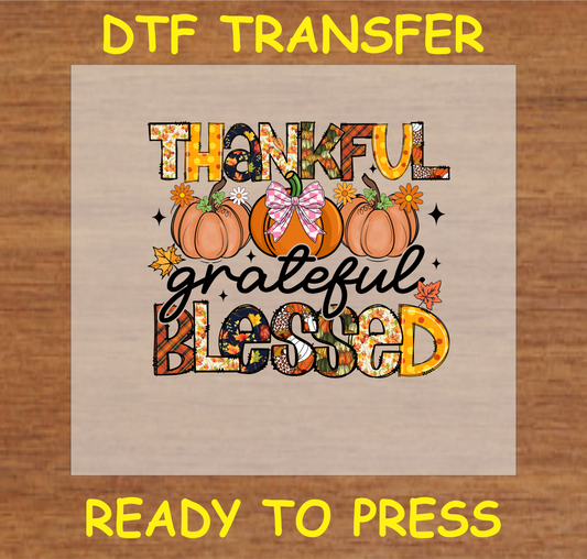 "Thankful Grateful Blessed" DTF transfer with pumpkins, florals, and colorful text, ready to press.