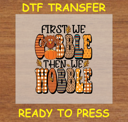 "First We Gobble Then We Wobble" DTF transfer featuring a turkey, pumpkins, and autumn elements, ready to press.