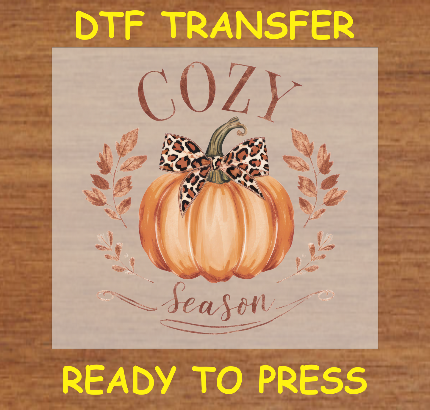 Cozy Season DTF transfer featuring a pumpkin with a leopard-print bow and fall leaves, perfect for seasonal apparel.