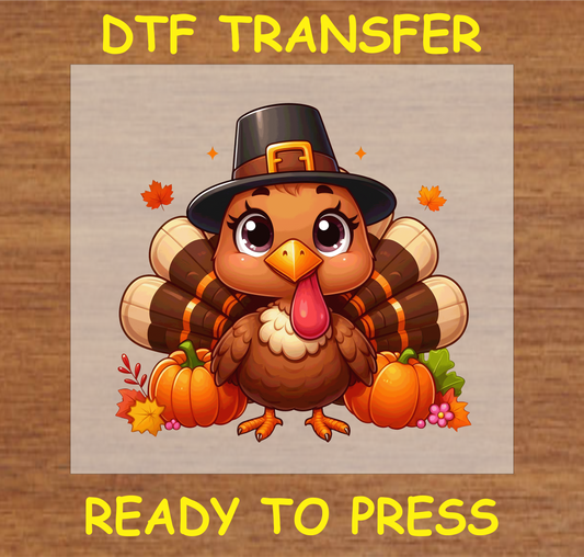 Cute Thanksgiving turkey DTF transfer with a pilgrim hat, pumpkins, and autumn leaves, perfect for festive apparel.