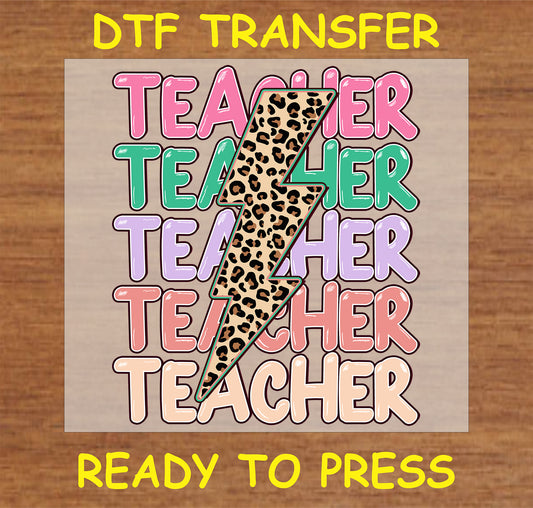 Teacher DTF Transfer with bold, colorful letters and a leopard print lightning bolt design.