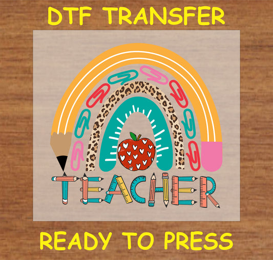 "Teacher DTF Transfer with a rainbow design made of pencils, paper clips, and leopard print"