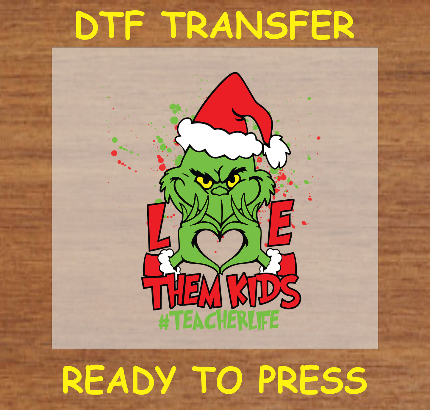 "Love Them Kids DTF Transfer with festive character in Santa hat forming a heart shape for teachers"