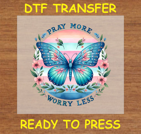 "Pray More Worry Less DTF Transfer featuring a colorful butterfly and floral design."