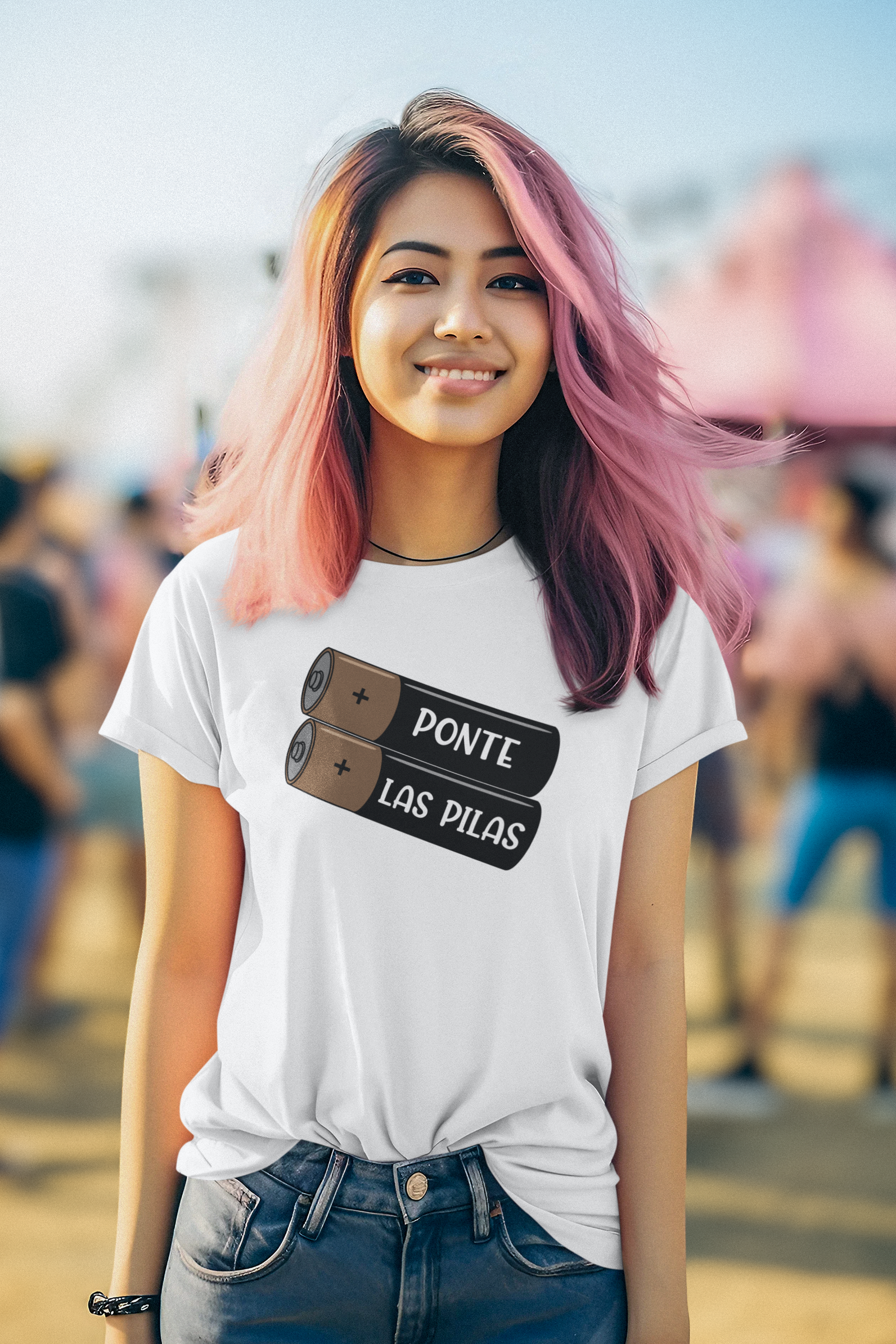 Women wearing a black &quot;Ponte Las Pilas&quot; T-shirt with a battery design, conveying a motivational message in Spanish.