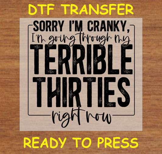 DTF transfer featuring the text 'Sorry I'm Cranky, I'm Going Through My Terrible Thirties Right Now,' perfect for custom apparel.