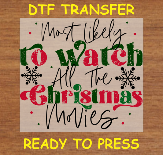 Festive DTF transfer with the phrase "Most Likely to Watch All the Christmas Movies" in red and green with snowflakes.