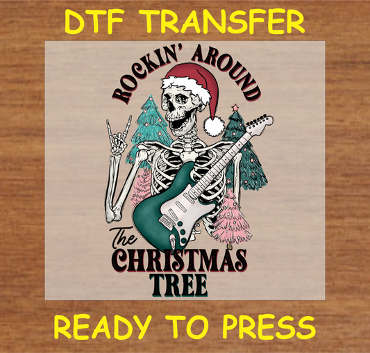 DTF transfer design featuring a skeleton in a Santa hat playing an electric guitar with Christmas trees in the background, with the text 'Rockin' Around the Christmas Tree.'