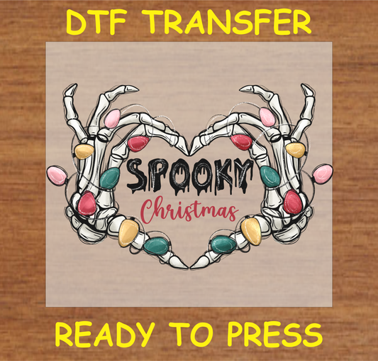 DTF transfer design featuring skeleton hands wrapped in colorful Christmas lights forming a heart shape with the text "Spooky Christmas."