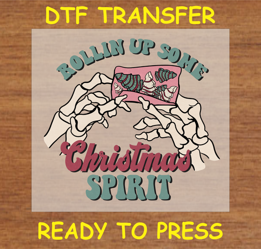 DTF transfer design featuring skeleton hands rolling up a festive-themed item with the text "Rollin' Up Some Christmas Spirit."